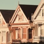 Row homes with a setting sun lighting up the front facades.